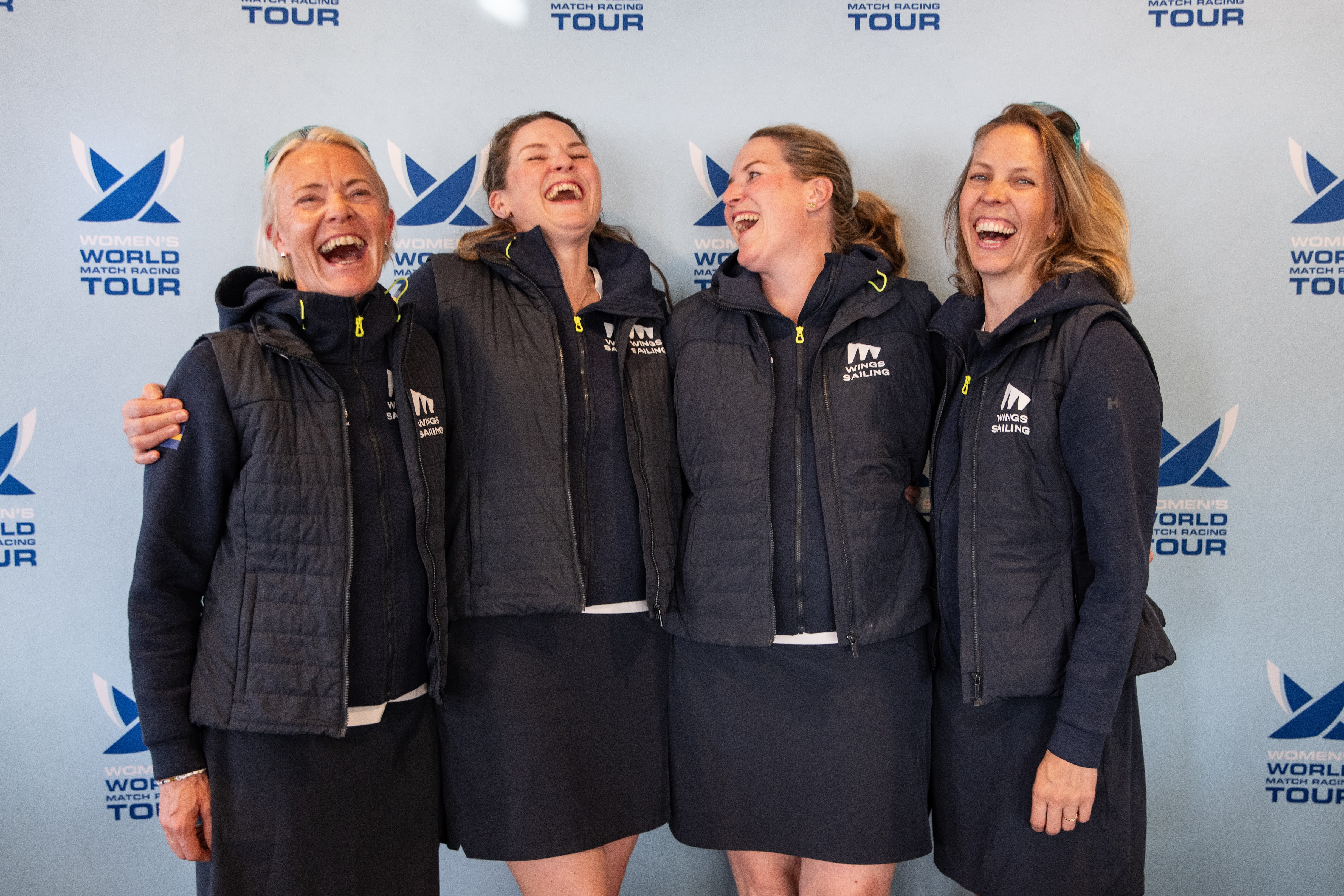 Competitors sharing a laugh at the reception
